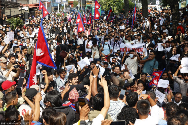 Thousands of young protesters wave Nepali flags and hold placards during the September 2025 Gen-Z protests in Kathmandu against the government’s social media ban.