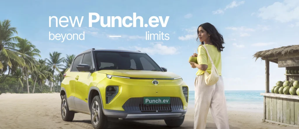 Tata Punch EV Facelift electric SUV captured in a high-resolution landscape image, showcasing updated front fascia, LED DRLs, closed EV grille, and modern design on an urban road.